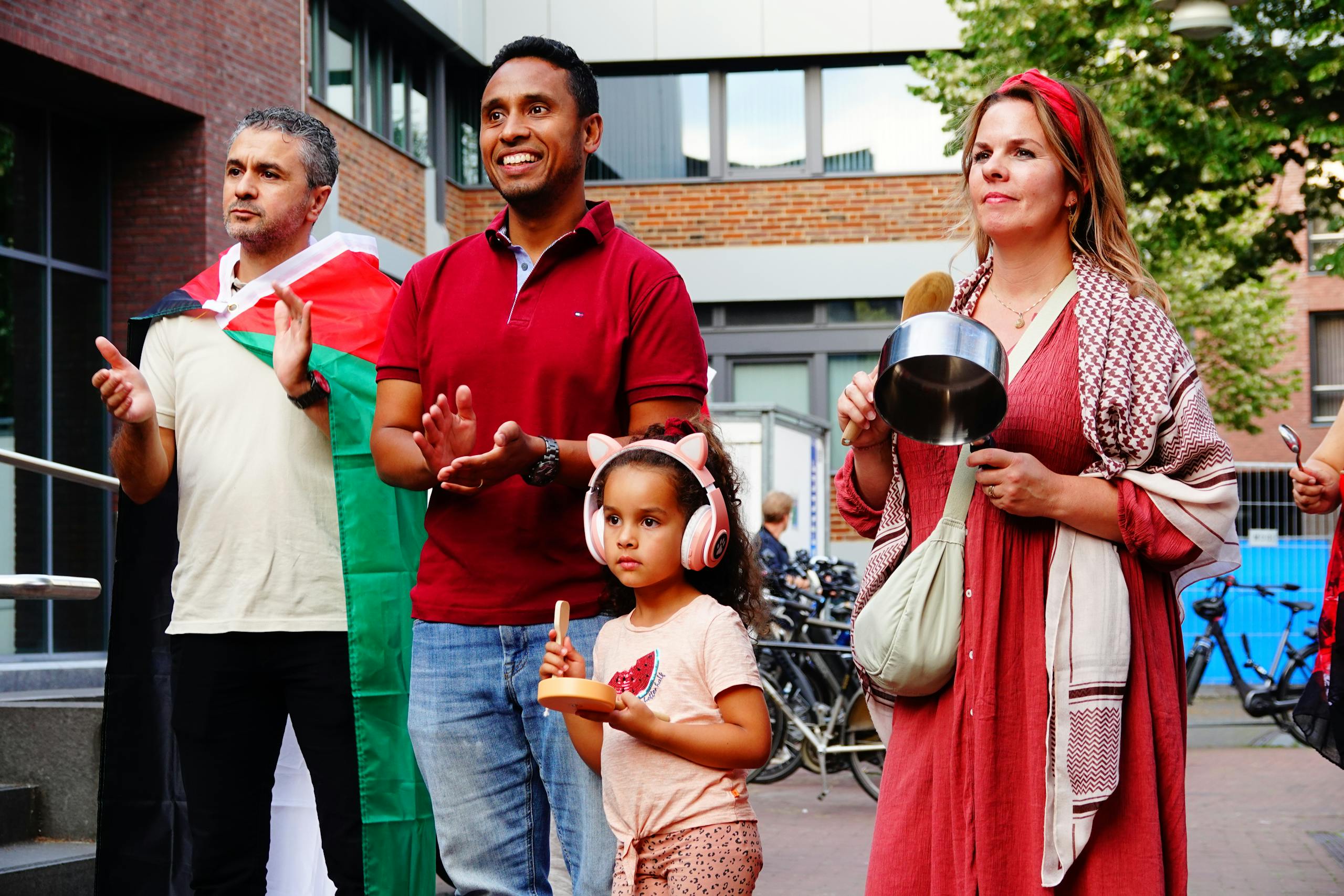 Diverse group of people participating in a protest outdoors in Horst, Limburg, Netherlands.
